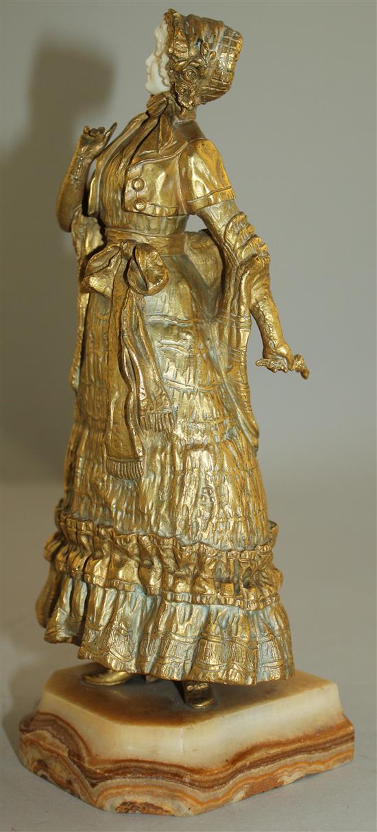 Rene Paul Marquet (French, 1879-1939). A gilt bronze and ivory figure of a lady wearing a bonnet, 10.25in.